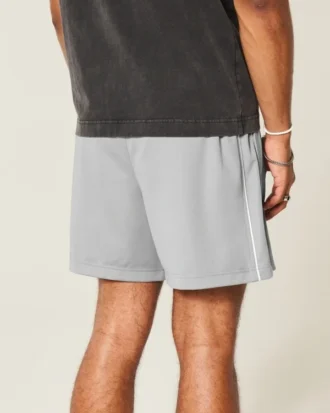 Short de football en tricot avec logo, longueur mi-cuisse