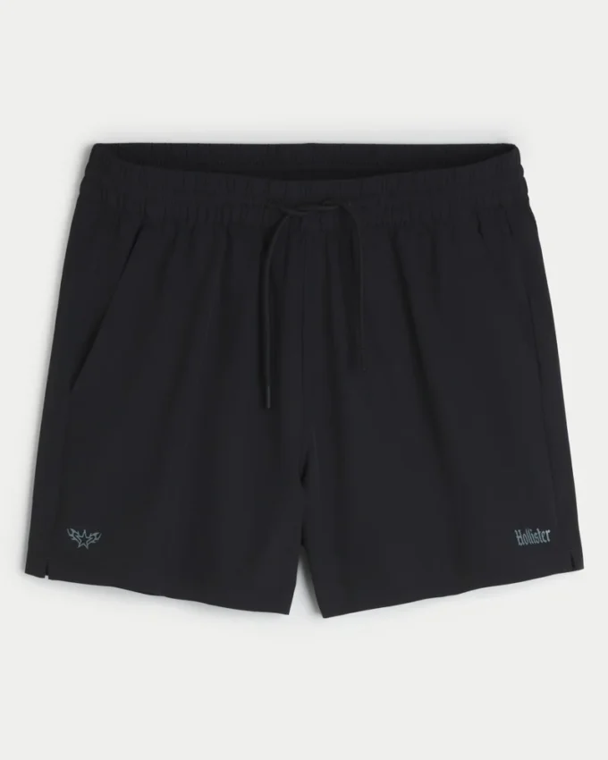 Short de sport avec logo mi-cuisse Short de sport avec logo mi-cuisse