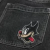 Short en denim super ample avec motif chat noir délavé Short en denim super ample avec motif chat noir délavé