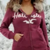 Sweat à capuche zippé avec logo graphique et bordure en fausse fourrure Sweat à capuche zippé avec logo graphique et bordure en fausse fourrure