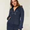 Sweat à capuche zippé avec motif étoile Sweat à capuche zippé avec motif étoile