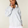 Sweat-shirt à fermeture éclair quart de longueur avec broderie en forme de nœud Gilly Hicks Sweat-shirt à fermeture éclair quart de longueur avec broderie en forme de nœud Gilly Hicks