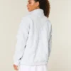Sweat-shirt à fermeture éclair quart de longueur avec broderie en forme de nœud Gilly Hicks Sweat-shirt à fermeture éclair quart de longueur avec broderie en forme de nœud Gilly Hicks