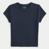 T-shirt bébé à col rond en tissu extensible et sans coutures T-shirt bébé à col rond en tissu extensible et sans coutures