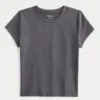 T-shirt bébé à col rond en tissu extensible et sans coutures T-shirt bébé à col rond en tissu extensible et sans coutures